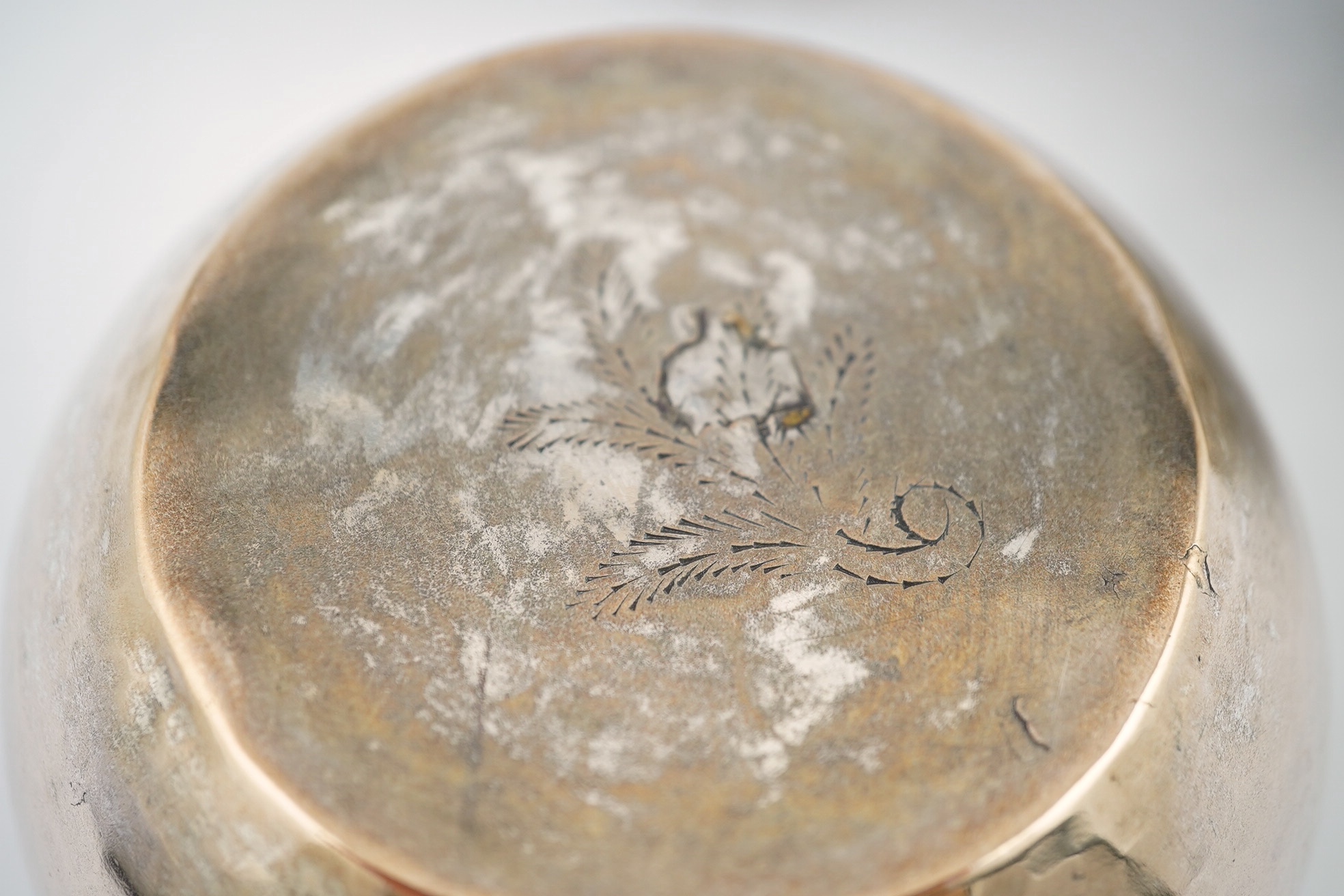 A pair of Burmese white metal bowls, embossed with figures, 12cm diameter, 220 and 224g and a plainer bowl, 110g. Condition – fair